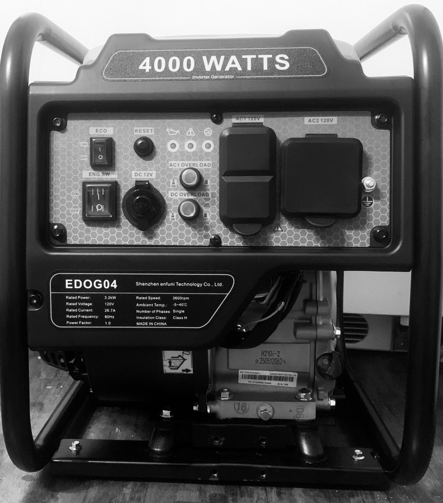 Boylan Generators' 4KW Gas Inverter Generator in a black and white filter laying on wood in front of a white background.